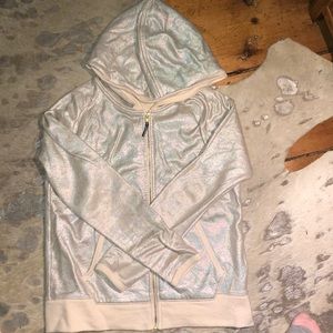 a holographic sip up sweater